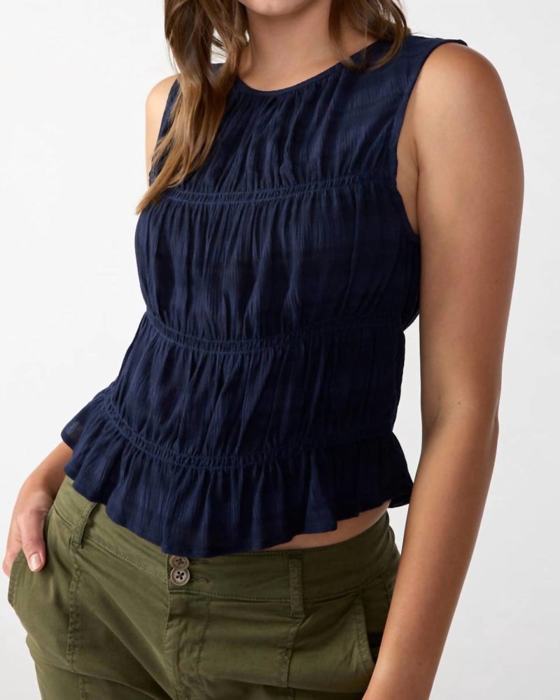 Front of a model wearing a size L Sleeveless Soft Smock Tank in Navy in Navy by Sanctuary. | dia_product_style_image_id:326777
